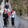 Investigators crossing suspension bridge