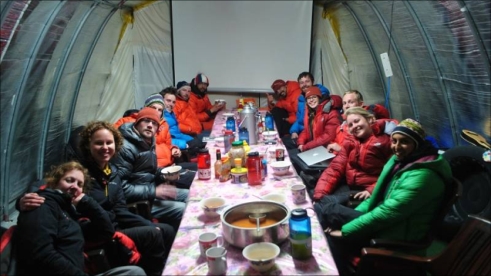 Base Camp team enjoying dinner in the mess tent